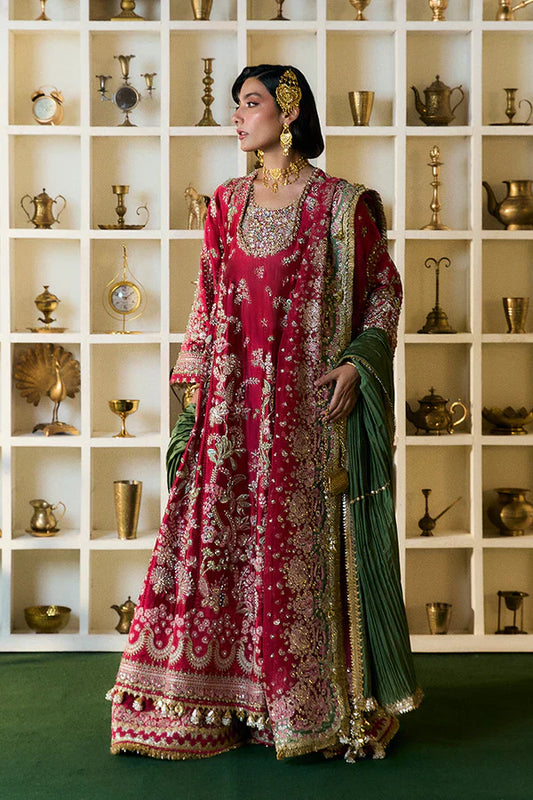 Suffuse Afsanae red bridal maxi dress featuring intricate hand embroidery with detailed floral and botanical motifs in gold and silver threadwork, paired with a heavily embellished red dupatta with ornate borders and a contrasting deep green velvet shawl, perfect for nikah, barat, reception, and formal wedding events.
