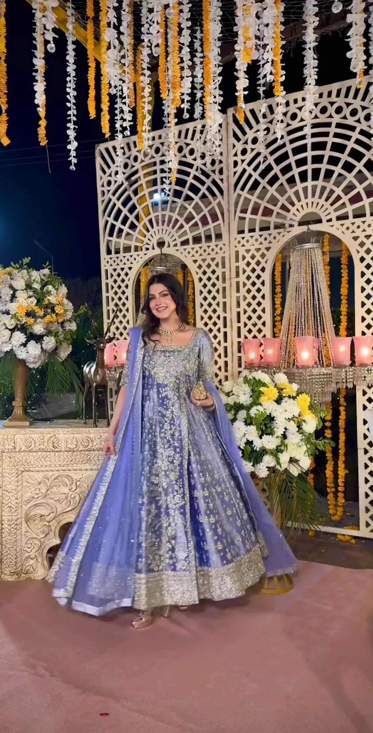 Haris Shakeel inspired Eyena ensemble in soft periwinkle-lilac featuring intricate silver zari, sequins, and resham embroidery delicately scattered across flowing panels with a richly embellished border, paired with a sheer net dupatta, perfect for festive occasions, mehndi functions, nikkah ceremonies, and formal gatherings.
