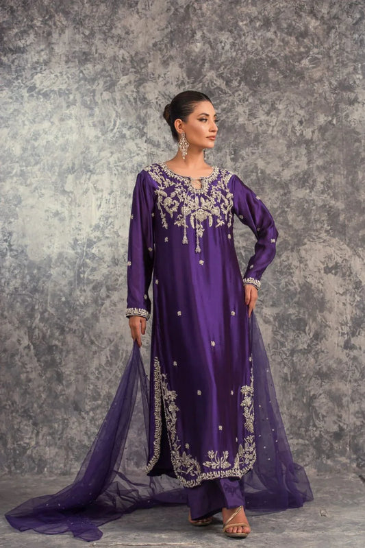 House of Sehrish Nadeem Amira Pakistani royal-inspired formal ensemble in a deep majestic hue featuring intricate embellishments that cascade gracefully, crafted for the modern muse with a heart rooted in tradition, perfect for weddings and formal occasions where subtle opulence reigns.