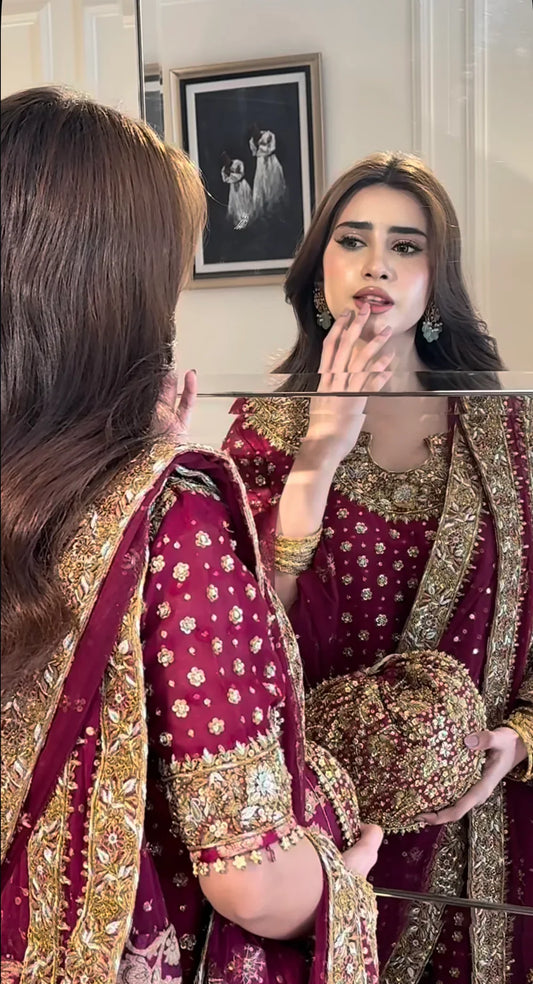 Haris Shakeel Aisha Afridi Pakistani designer formal ensemble crafted in rich tones with intricate embellishments and refined craftsmanship, featuring delicate details that blend tradition and sophistication, perfect for grand occasions and weddings.