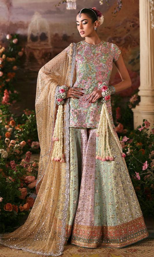 Nomi Ansari Fairytale pastel bridal lehenga choli featuring a harmonious blend of blush pink, powder blue, and pistachio tones with intricate hand embroidery, delicate zari work, and shimmering embellishments on a beautifully panelled lehenga with a finely embellished choli and a dreamy net dupatta with subtle detailing, perfect for valima, engagement, nikah, and reception events.