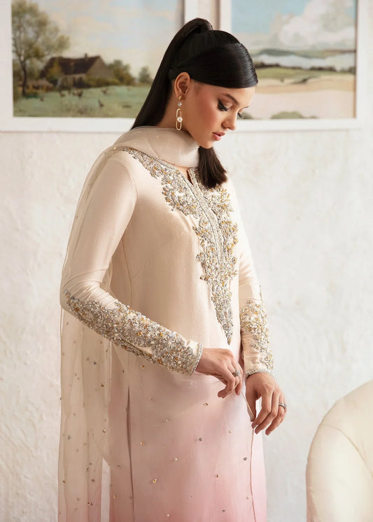 Maura ombre pink Pakistani designer formal ensemble featuring a pure raw silk shirt with intricate hand embellishments, paired with matching raw silk culottes and an organza dupatta with celestial accents, creating a glamorous and sophisticated look for formal events and weddings.