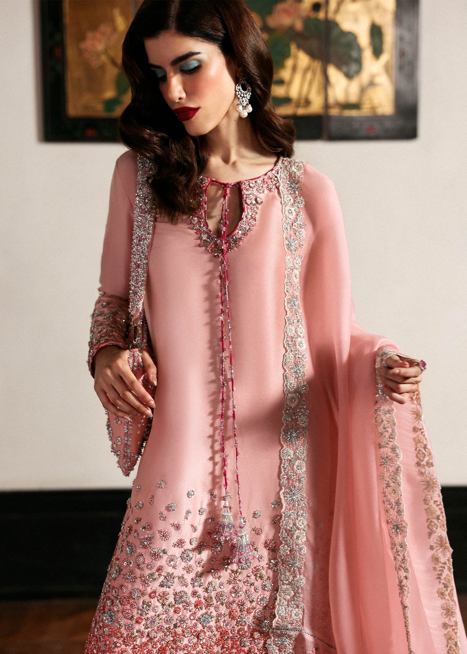 Hussain Rehar Evara ensemble featuring intricate embellishments with refined detail on rich flowing fabric in a statement silhouette with bold accents and a perfectly tailored cut, paired with a graceful dupatta, perfect for weddings and formal occasions.