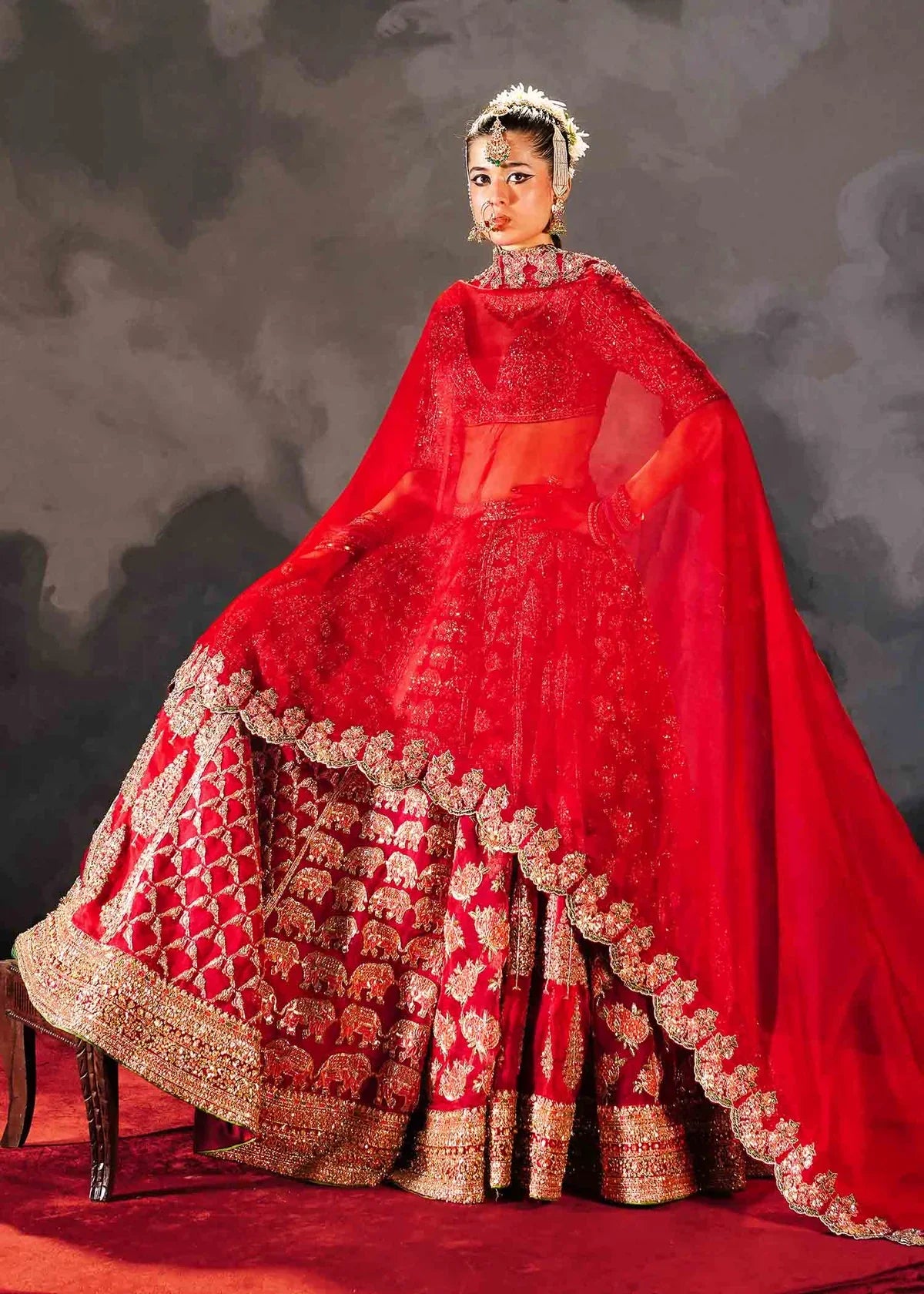 Hussain Rehar Raaqs red pure organza lehenga choli featuring intricate hand embellishments with rich dimensional finish, paired with a pure organza scallop cutwork dupatta that drapes gracefully with ethereal lightweight movement, perfect for bridal wear, weddings, receptions, and grand celebrations.