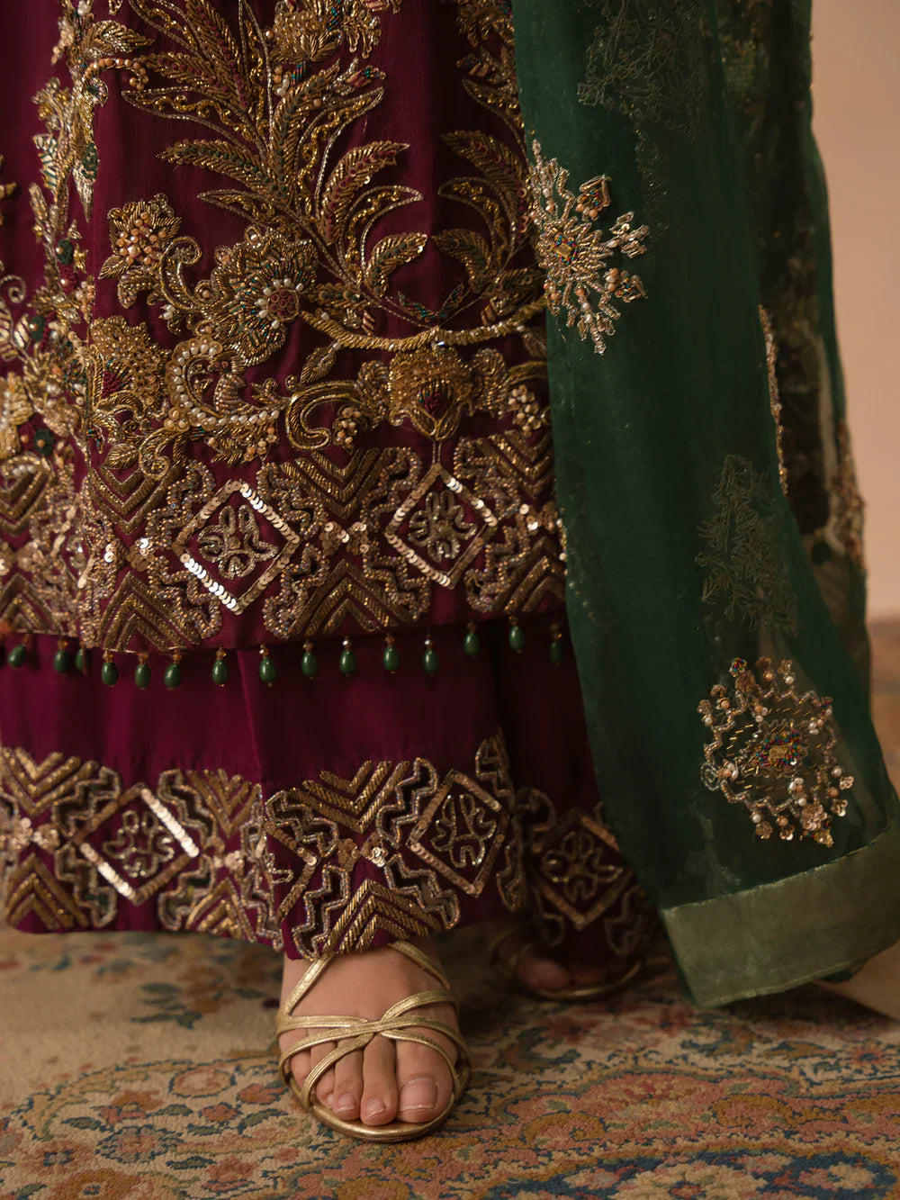 Abeera Usman Burgundy Dusk rich burgundy formal ensemble featuring meticulous detailing and delicate embellishments with a fluid silhouette that blends traditional craftsmanship with modern elegance, perfect for weddings, receptions, festive gatherings, and evening events.