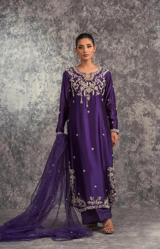 House of Sehrish Nadeem Amira Pakistani royal-inspired formal ensemble in a deep majestic hue featuring intricate embellishments that cascade gracefully, crafted for the modern muse with a heart rooted in tradition, perfect for weddings and formal occasions where subtle opulence reigns.