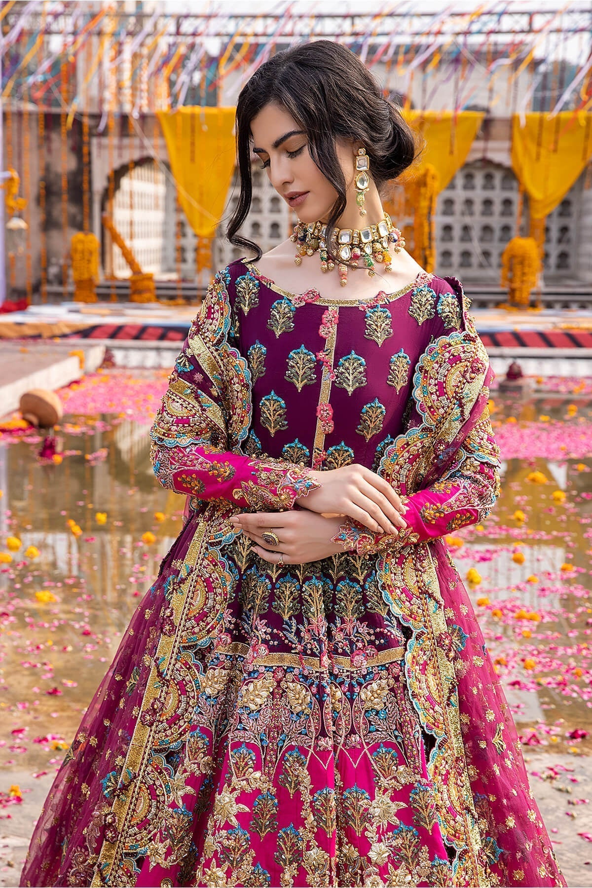Mina Kashif Mahrosh luxury Pakistani formal ensemble featuring intricate hand embellishments and refined craftsmanship on a gracefully draped silhouette, perfect for weddings and formal occasions.
