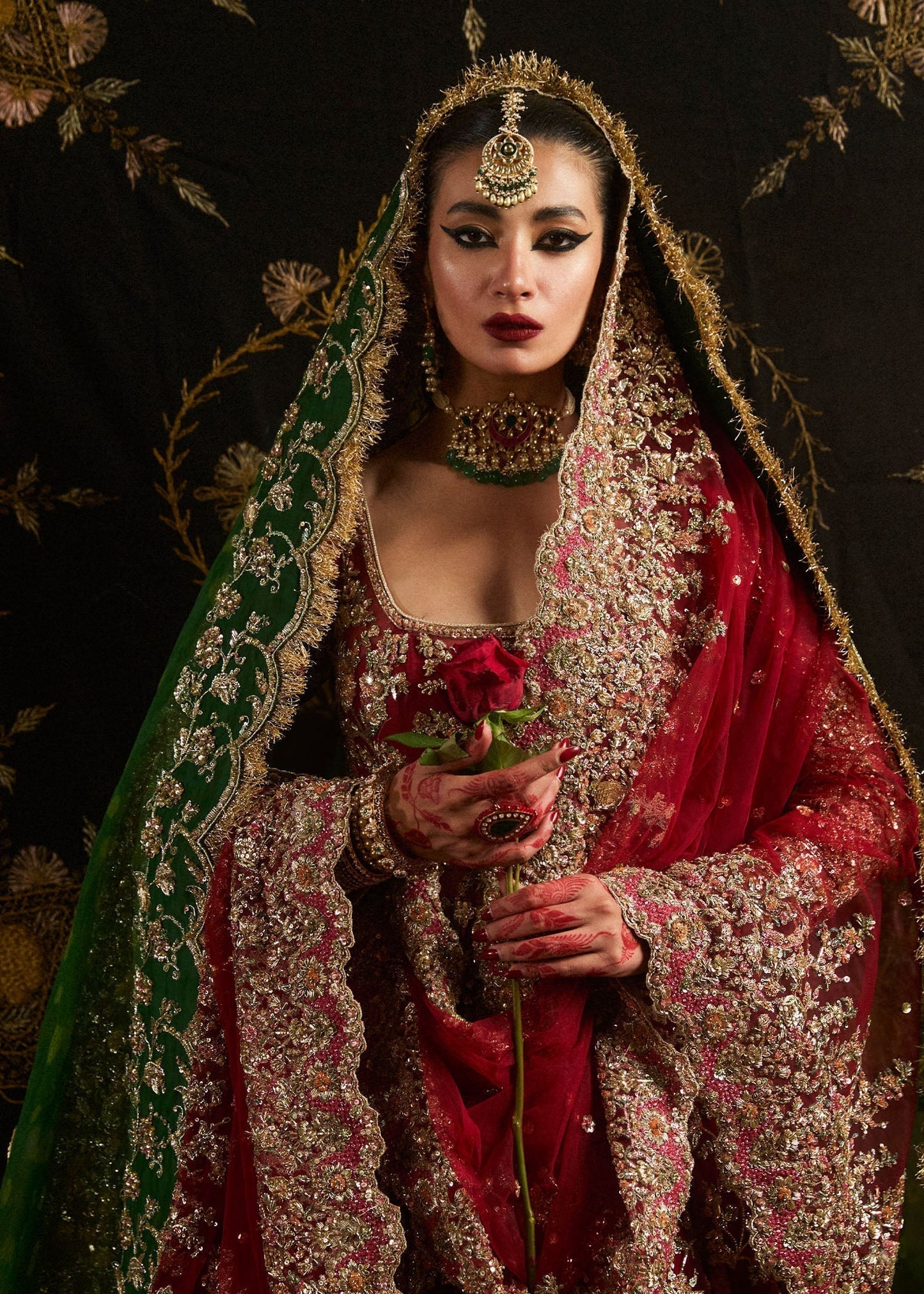 Hussain Rehar Qashqaye deep maroon lehenga choli featuring exquisite handwork that shimmers with delicate light, with a voluminous lehenga paired with an intricately worked choli, perfect for bridal wear and grand wedding celebrations.