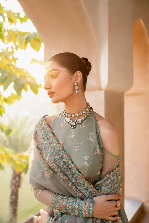 Gossamer Pakistani designer unstitched formal ensemble featuring intricate organza embroidery with components including embroidered blouse pieces, panels, borders, and dupatta, designed to be tailored into a lehnga or other silhouette, perfect for weddings and festive occasions.