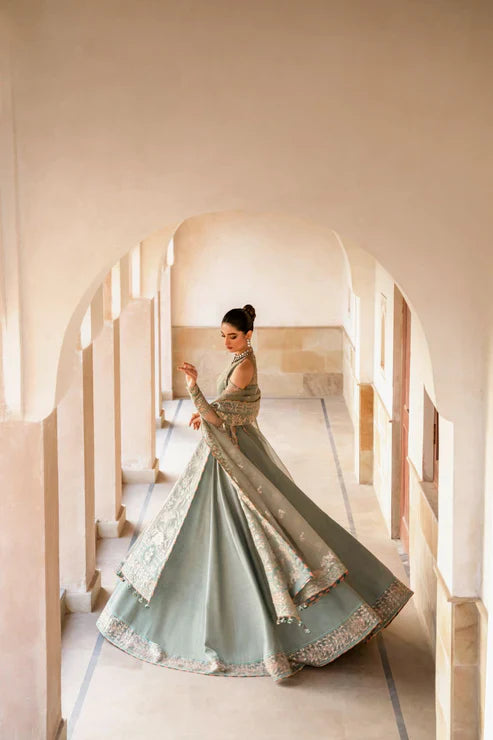 Gossamer Pakistani designer unstitched formal ensemble featuring intricate organza embroidery with components including embroidered blouse pieces, panels, borders, and dupatta, designed to be tailored into a lehnga or other silhouette, perfect for weddings and festive occasions.