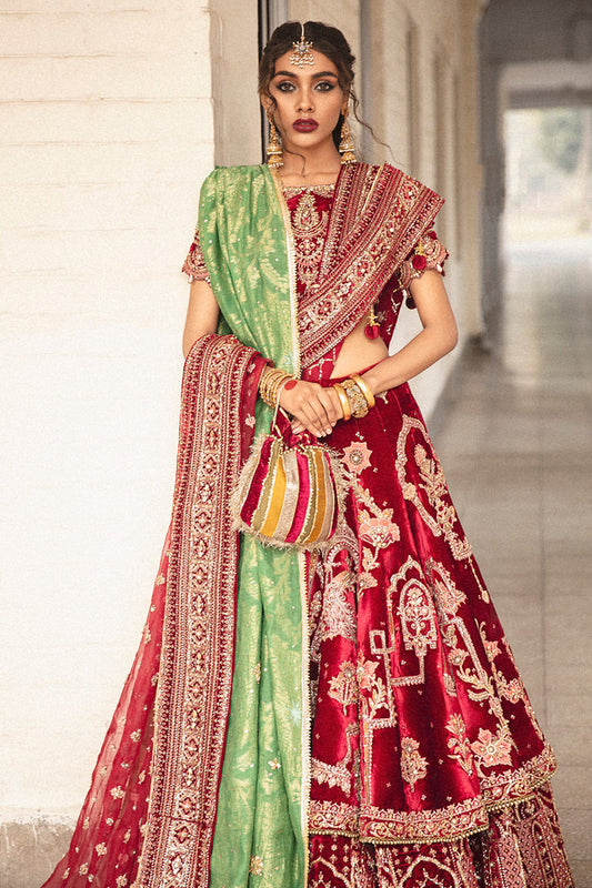 Mohsin Naveed Ranjha MNR HR-71 sindoori red raw silk bridal ensemble featuring a half-sleeved boat neck choli with hand-embellished motifs, worn with a two-tiered lehnga doused in signature Mughal miniature patterns, complete with a chan booti dupatta and a hand-loomed cotton net jamawar shawl, Pakistani luxury wedding formal wear.