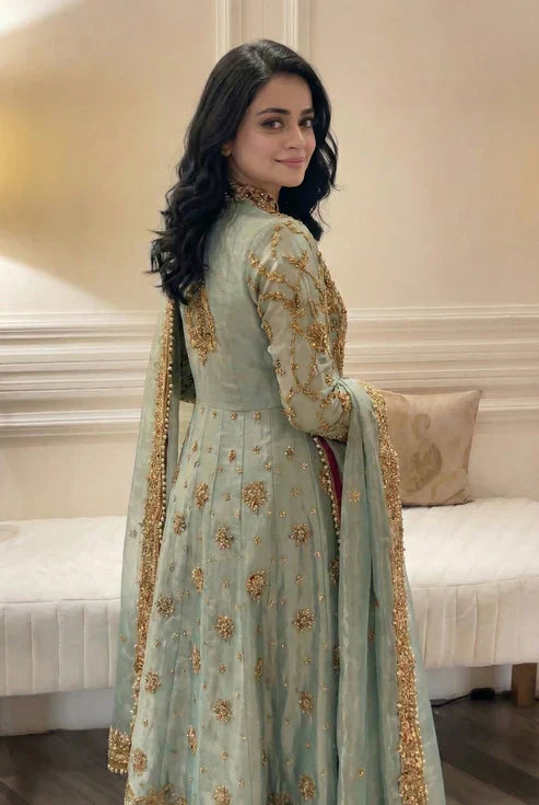 Haris Shakeel Urooj unstitched 3-piece bridal ensemble from the Wedding Luxury Myssory collection featuring exquisite hand embellishments and intricate embroidery with rich textures and sophisticated patterns that blend traditional bridal aesthetics with contemporary flair, crafted in premium quality fabric for customizable tailoring to create a regal wedding look.