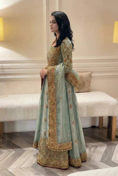 Haris Shakeel Urooj unstitched 3-piece bridal ensemble from the Wedding Luxury Myssory collection featuring exquisite hand embellishments and intricate embroidery with rich textures and sophisticated patterns that blend traditional bridal aesthetics with contemporary flair, crafted in premium quality fabric for customizable tailoring to create a regal wedding look.