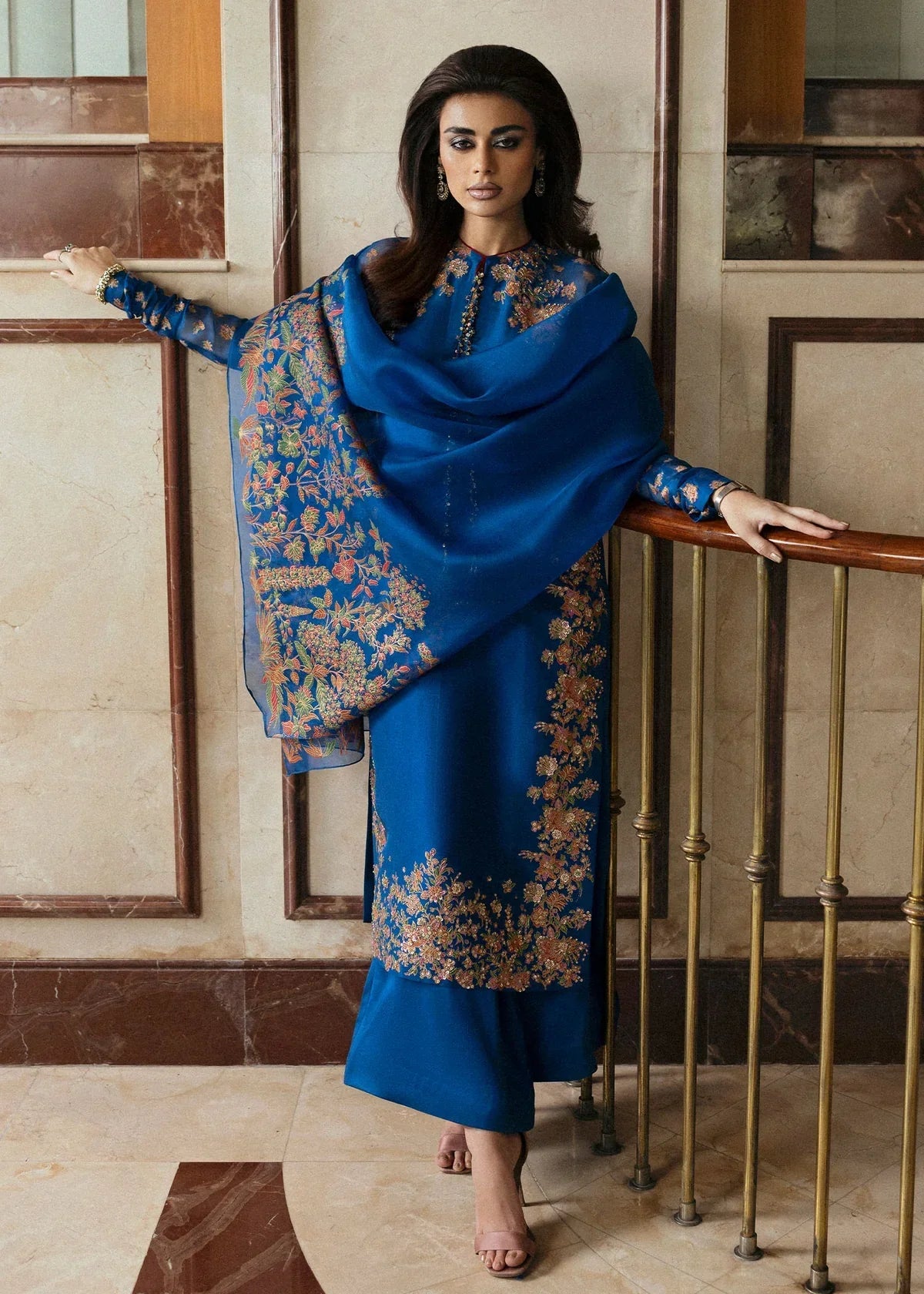 Hussain Rehar Serene teal blue raw silk shirt featuring vibrant screen-printed details with delicate embellishments and chic raglan sleeves in sheer screen-printed organza, paired with plain culottes and a matching screen-printed dupatta, perfect for festive gatherings and semi-formal events.