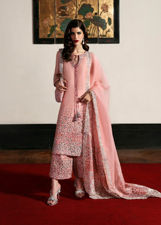 Hussain Rehar Evara ensemble featuring intricate embellishments with refined detail on rich flowing fabric in a statement silhouette with bold accents and a perfectly tailored cut, paired with a graceful dupatta, perfect for weddings and formal occasions.