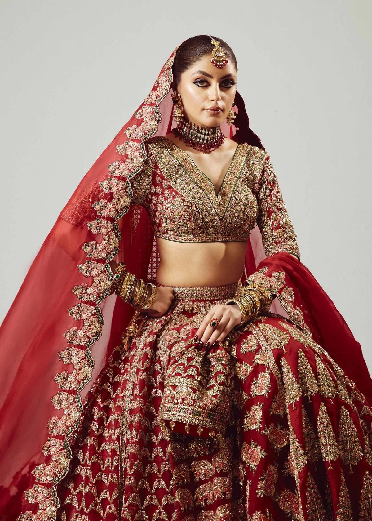 Hussain Rehar Raaqs red pure organza lehenga choli featuring intricate hand embellishments with rich dimensional finish, paired with a pure organza scallop cutwork dupatta that drapes gracefully with ethereal lightweight movement, perfect for bridal wear, weddings, receptions, and grand celebrations.