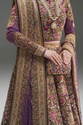 Fahad Hussayn Mirbail wine net lehenga choli featuring a structured corset-style blouse with intricate embroidery and handwork embellishments, paired with a flowing net lehenga in rich wine color and a lightweight net dupatta with an exquisitely embellished border, perfect for bridal wear, weddings, receptions, and festive celebrations.