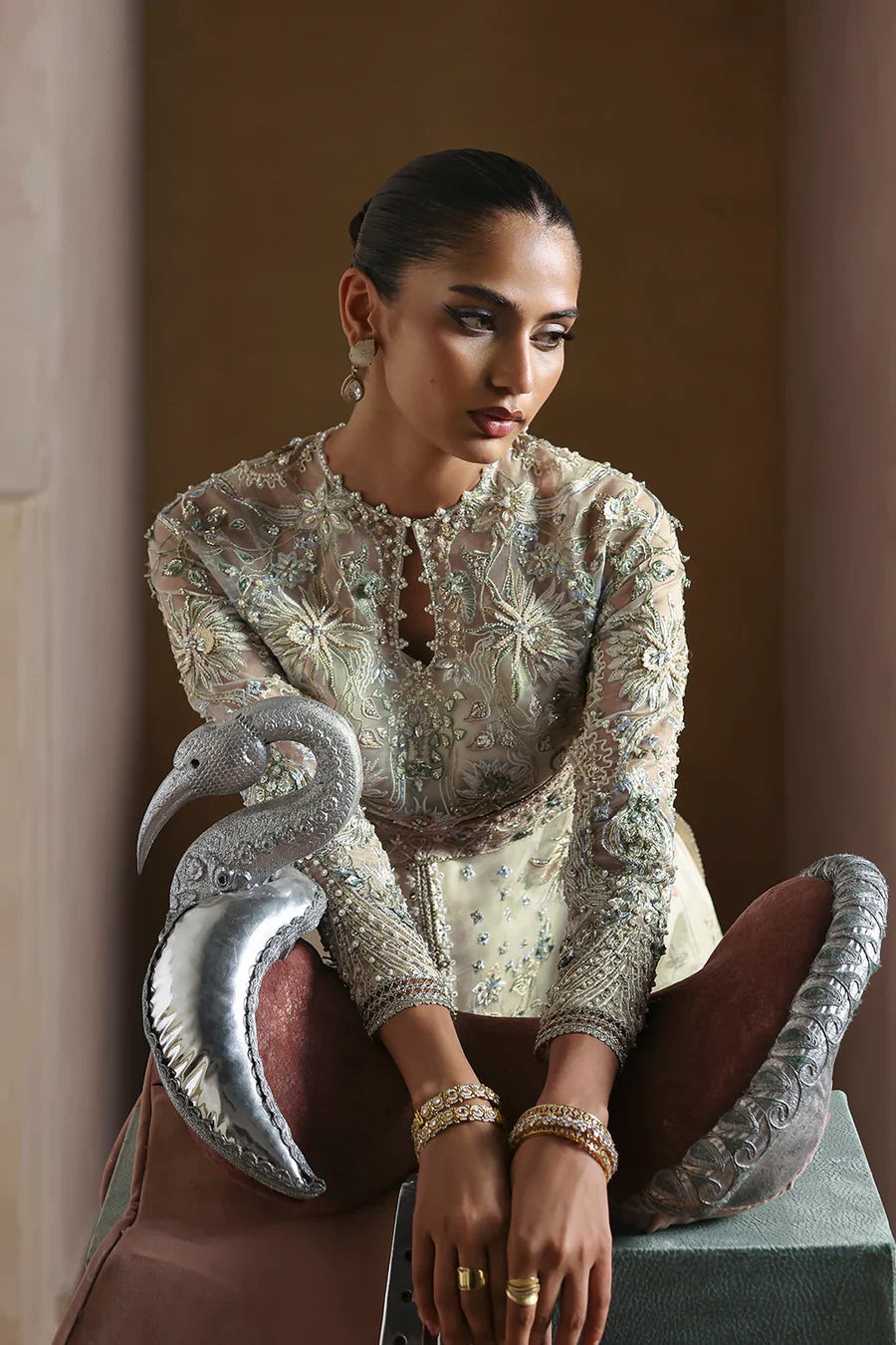 Soraya Novara ivory and gold formal ensemble featuring a beautifully embellished shirt with intricate handwork blending delicate thread embroidery, shimmering sequins, and fine embellishments on a soft ivory base with detailed gold accents, paired with a complementing dupatta, perfect for weddings, receptions, engagement ceremonies, and festive celebrations.