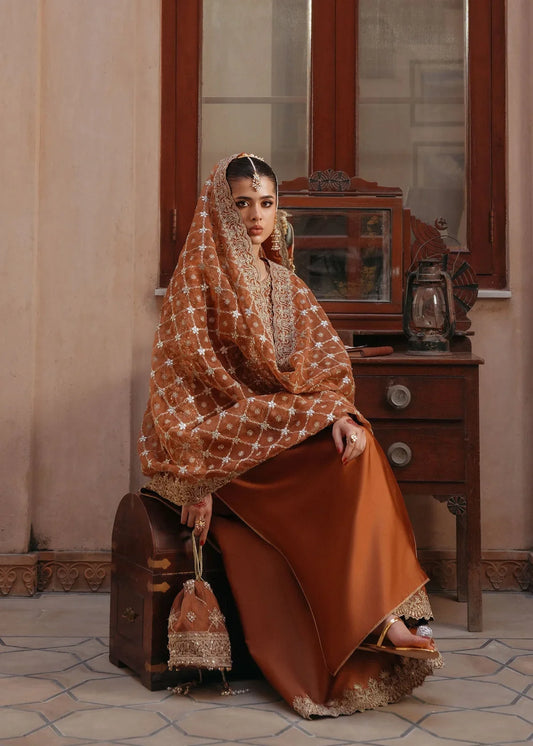  Zulekha Golden Mocha Pakistani formal three-piece ensemble featuring a long shirt in luxurious Korean silk with delicate embroidery on the neckline and sleeves, paired with matching flared trousers and a fully embroidered organza dupatta, perfect for festive evenings and elegant gatherings.