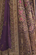 Fahad Hussayn Mirbail wine net lehenga choli featuring a structured corset-style blouse with intricate embroidery and handwork embellishments, paired with a flowing net lehenga in rich wine color and a lightweight net dupatta with an exquisitely embellished border, perfect for bridal wear, weddings, receptions, and festive celebrations.